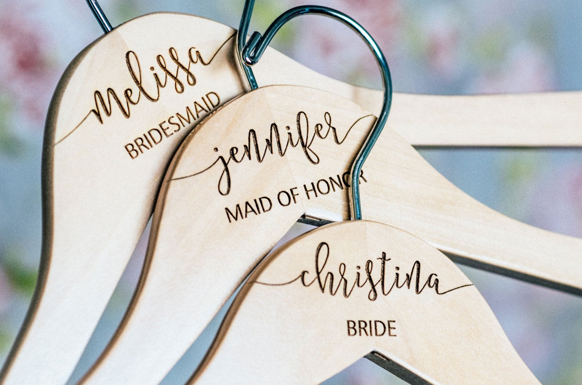 A Set Of Personalized Wooden Bridesmaid Hangers