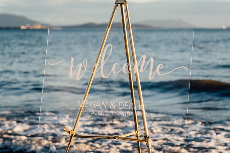 Acrylic wedding welcome sign with vinyl decal at a beach style wedding  