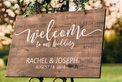 Personalized wooden wedding welcome to our wedding sign with vinyl decal