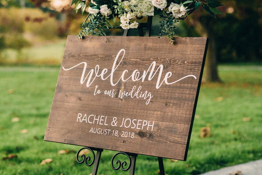 Personalized wooden wedding welcome to our wedding sign with vinyl decal